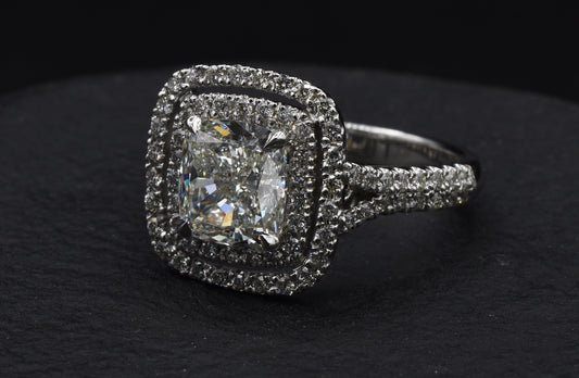 Cushion cut diamond engagement ring with double halo