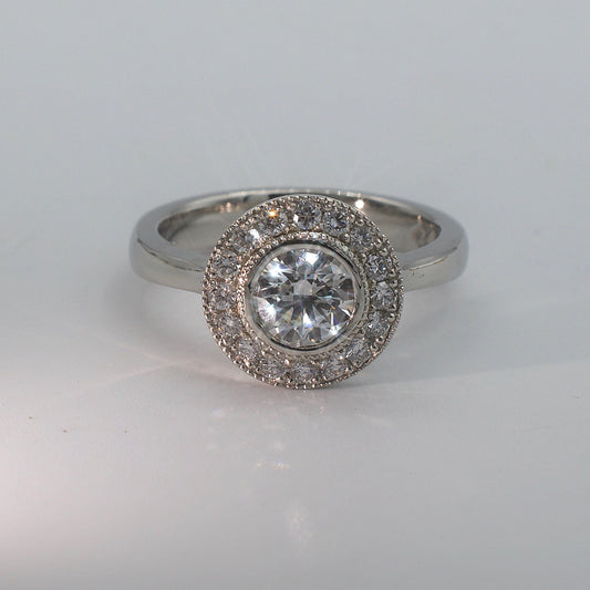 CAELORA | ROUND DIAMOND ENGAGEMENT RING WITH HALO